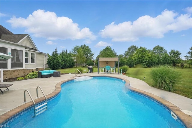 swimming pool featuring a patio, an outdoor living space, and a yard
