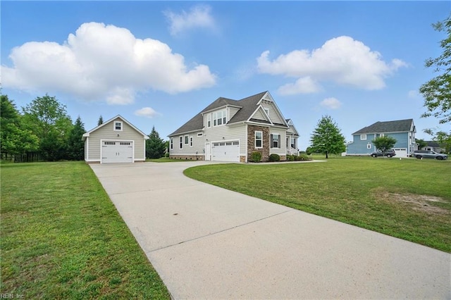 view of front facade featuring driveway, stone siding, a front lawn, and an outbuilding