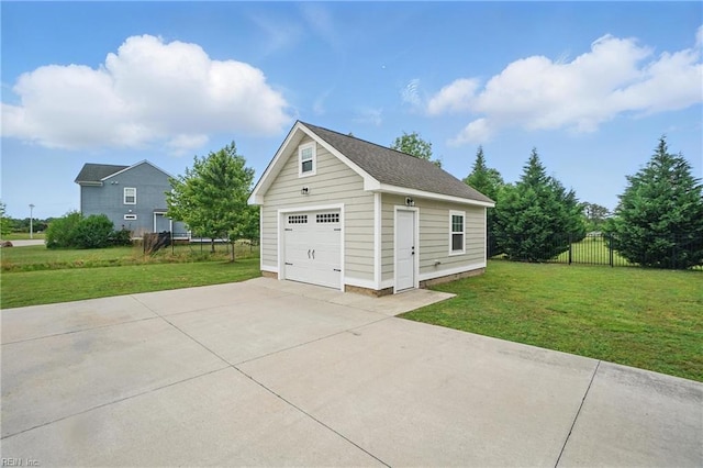 detached garage with concrete driveway