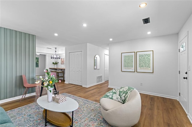 728 23rd St, Newport News, VA 23607 - living area with wood finished floors, visible vents, and baseboards