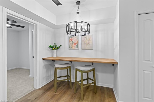 728 23rd St, Newport News, VA 23607 - dining area featuring baseboards, ceiling fan with notable chandelier, and wood finished floors