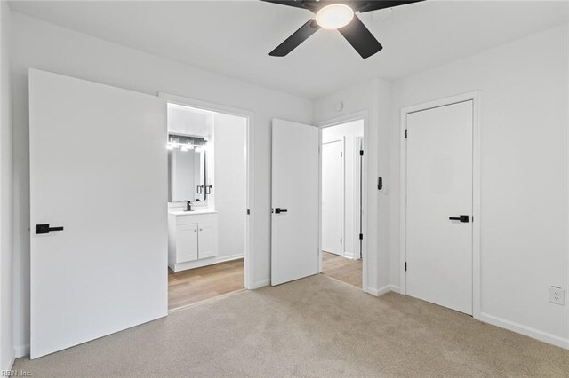 728 23rd St, Newport News, VA 23607 - unfurnished bedroom with a sink, light colored carpet, ensuite bath, a ceiling fan, and baseboards