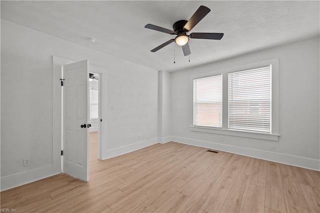 325 S Main St, Suffolk, VA 23434 - unfurnished room featuring baseboards, light wood finished floors, and ceiling fan