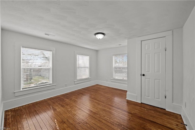 325 S Main St, Suffolk, VA 23434 - empty room featuring baseboards, visible vents, and dark wood finished floors