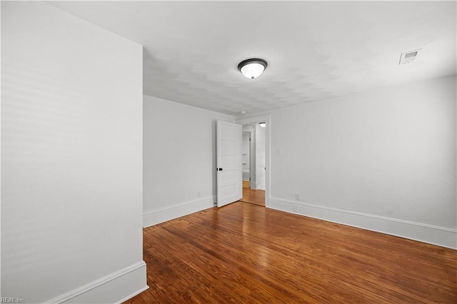 325 S Main St, Suffolk, VA 23434 - empty room featuring baseboards, visible vents, and wood finished floors
