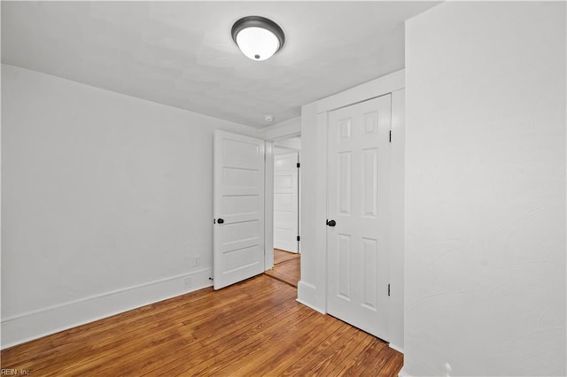 325 S Main St, Suffolk, VA 23434 - empty room with baseboards and wood finished floors