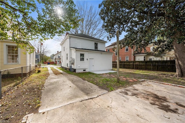 325 S Main St, Suffolk, VA 23434 - rear view of property with concrete driveway, a patio area, and fence private yard