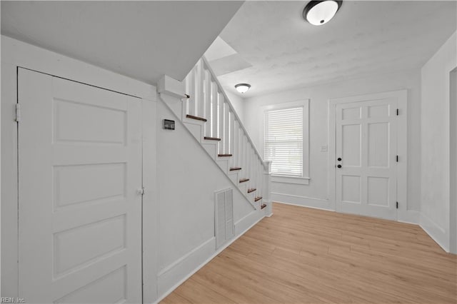 325 S Main St, Suffolk, VA 23434 - foyer with baseboards, stairs, light wood-style flooring, and visible vents