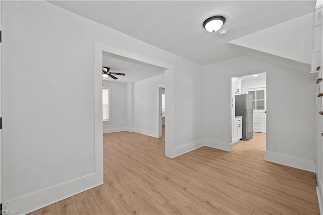 325 S Main St, Suffolk, VA 23434 - spare room with a ceiling fan, baseboards, and light wood-style flooring