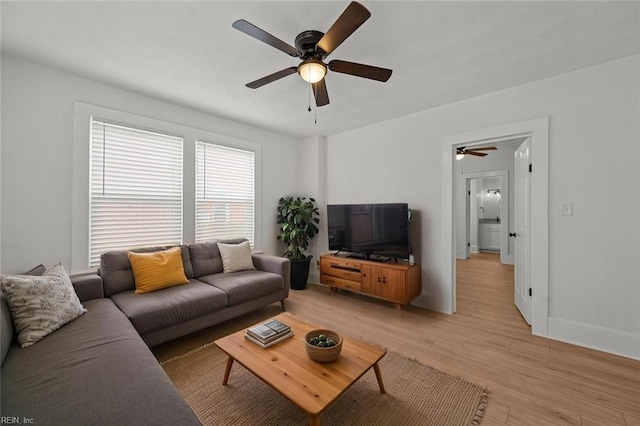 325 S Main St, Suffolk, VA 23434 - living area featuring ceiling fan, light wood-style flooring, and baseboards