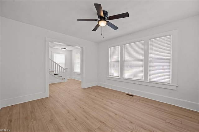 325 S Main St, Suffolk, VA 23434 - spare room featuring light wood-type flooring, visible vents, baseboards, and ceiling fan