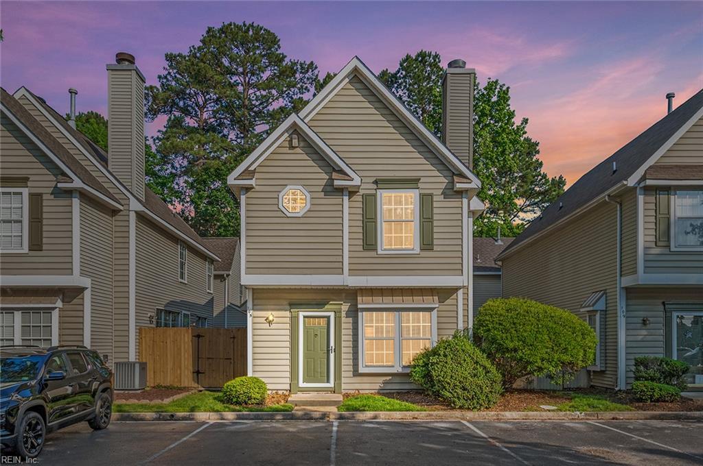 105 Watson Dr, Newport News, VA 23602 - traditional-style house featuring uncovered parking, fence, and a chimney