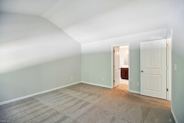 bonus room featuring carpet, vaulted ceiling, and baseboards