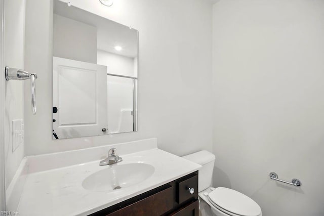 bathroom with toilet and vanity