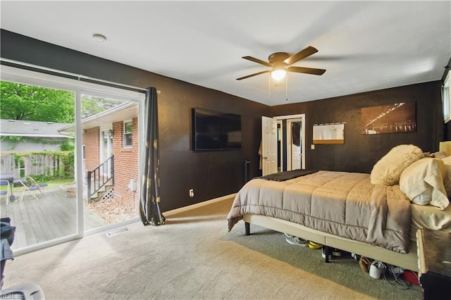 carpeted bedroom with ceiling fan, baseboards, visible vents, and access to exterior