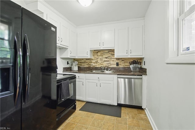 kitchen featuring a sink, tasteful backsplash, black appliances, white cabinetry, and baseboards
