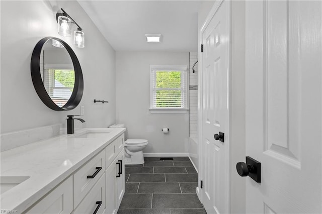 full bath with toilet, tile patterned flooring, double vanity, baseboards, and  shower combination