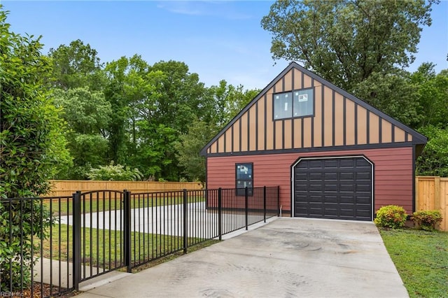 detached garage with concrete driveway
