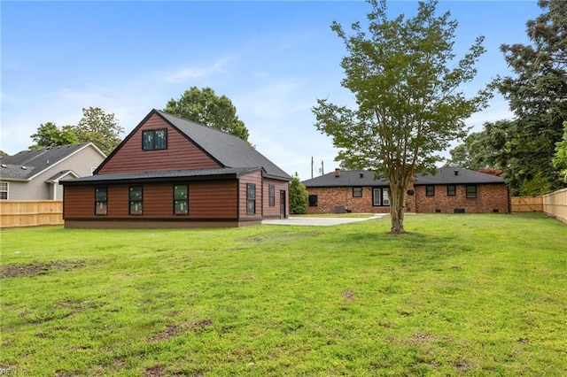 back of house with a patio