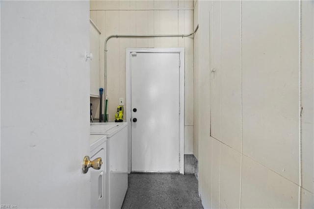 interior space featuring washing machine and clothes dryer and laundry area