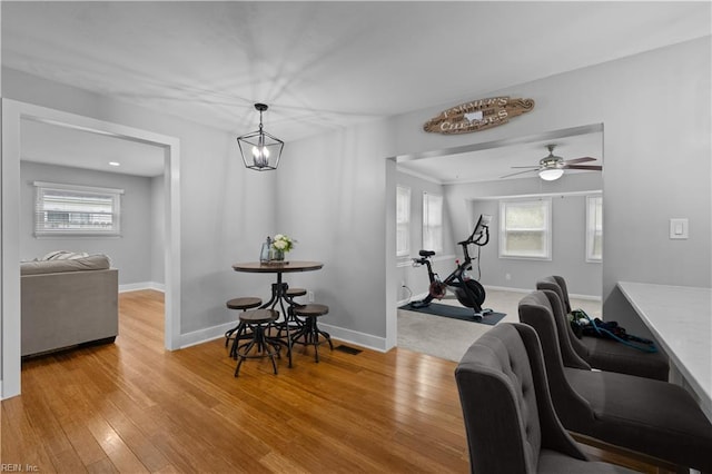 dining room featuring baseboards and wood finished floors