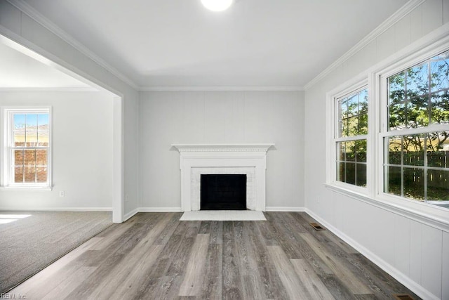 937 Sherry Cir, Newport News, VA 23608 - unfurnished living room featuring baseboards, ornamental molding, visible vents, a brick fireplace, and wood finished floors