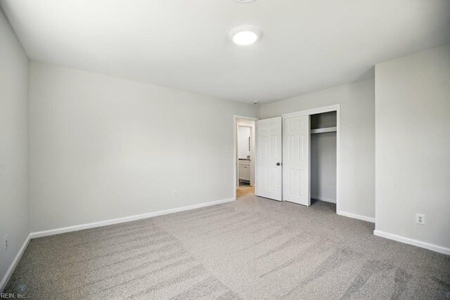 937 Sherry Cir, Newport News, VA 23608 - unfurnished bedroom with carpet floors, baseboards, and a closet