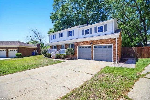 937 Sherry Cir, Newport News, VA 23608 - traditional-style home with brick siding, fence, covered porch, concrete driveway, and a front yard