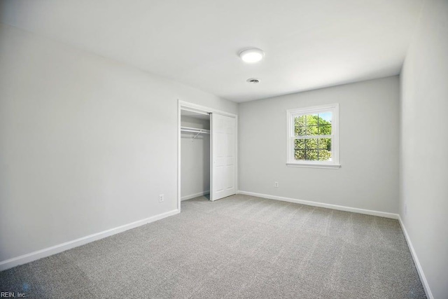 937 Sherry Cir, Newport News, VA 23608 - unfurnished bedroom featuring baseboards, carpet flooring, and a closet