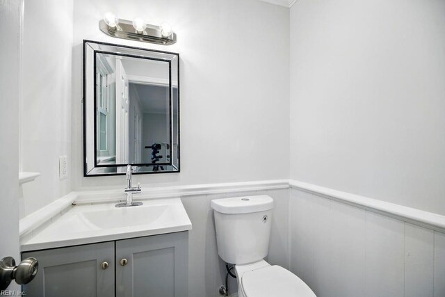 937 Sherry Cir, Newport News, VA 23608 - bathroom featuring vanity, toilet, and a wainscoted wall