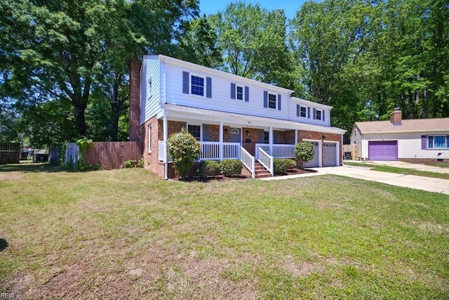 937 Sherry Cir, Newport News, VA 23608 - view of front facade featuring brick siding, fence, covered porch, concrete driveway, and a front lawn
