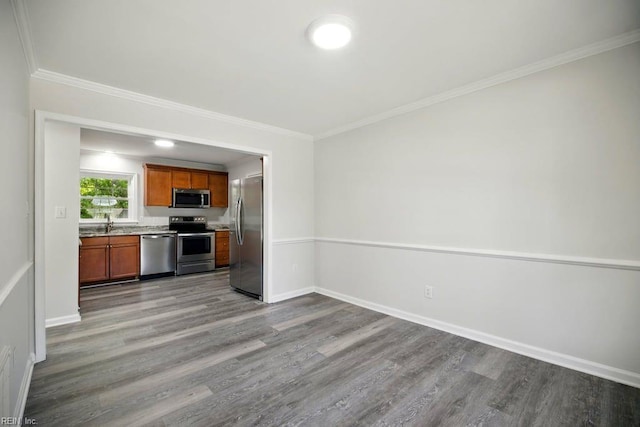 937 Sherry Cir, Newport News, VA 23608 - kitchen featuring light countertops, stainless steel appliances, crown molding, and dark wood-style floors