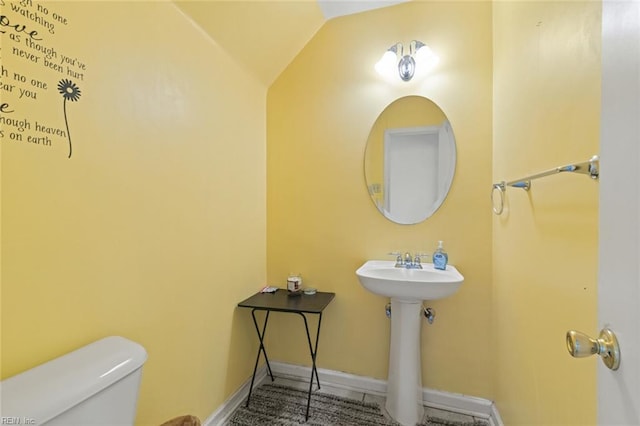 120 Commodore Dr, Hampton, VA 23669 - half bathroom with toilet, baseboards, vaulted ceiling, and a sink