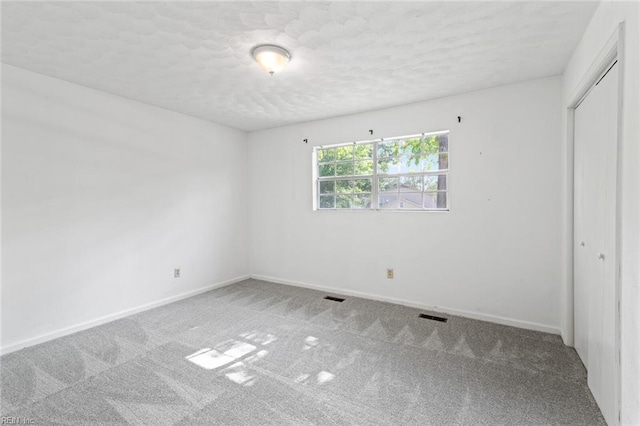120 Commodore Dr, Hampton, VA 23669 - unfurnished bedroom featuring carpet, a closet, a textured ceiling, and baseboards