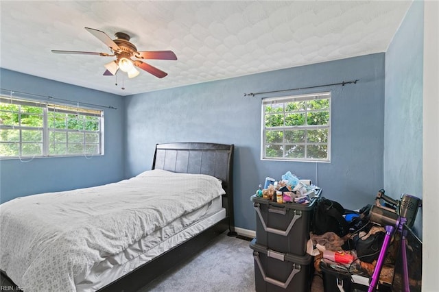 120 Commodore Dr, Hampton, VA 23669 - carpeted bedroom with multiple windows and a ceiling fan