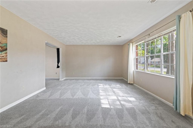 120 Commodore Dr, Hampton, VA 23669 - spare room with carpet flooring, baseboards, and a textured ceiling