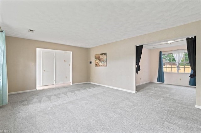 120 Commodore Dr, Hampton, VA 23669 - spare room featuring carpet, baseboards, and a textured ceiling
