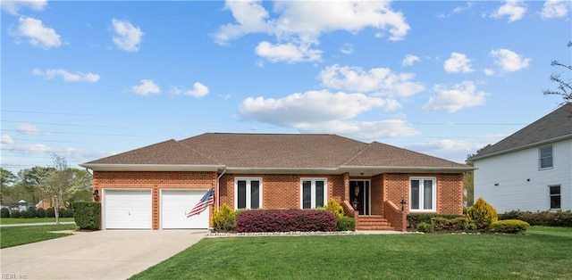 ranch-style house featuring brick siding, a garage, concrete driveway, and a front yard