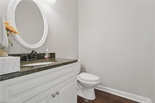 1725 Burson Dr, Chesapeake, VA 23323 - half bath with wood finished floors, vanity, toilet, and baseboards