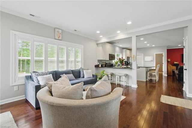 1725 Burson Dr, Chesapeake, VA 23323 - living area featuring ornamental molding, dark wood finished floors, baseboards, and recessed lighting