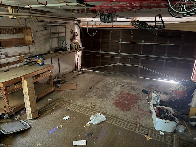 basement with a workshop area and a garage