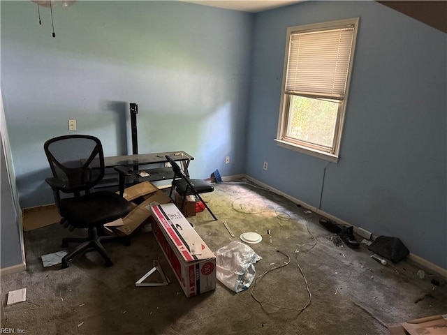 carpeted office space with baseboards
