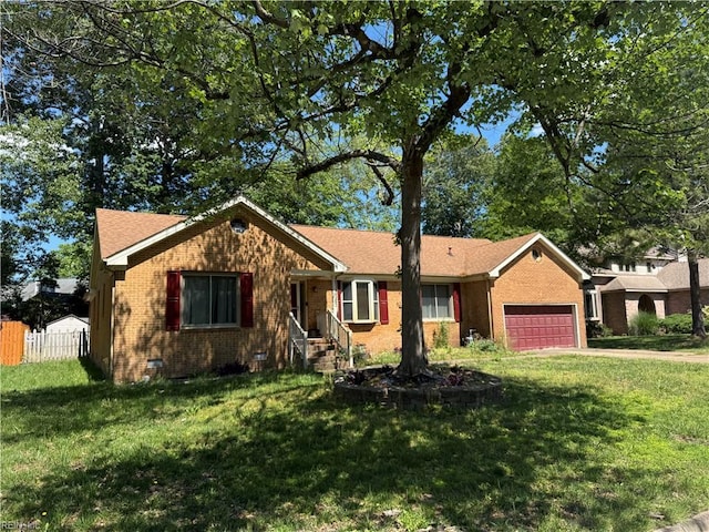 ranch-style home featuring an attached garage, brick siding, and crawl space
