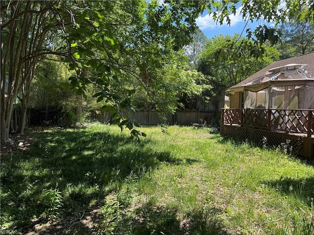view of yard featuring fence, a gazebo, and a wooden deck