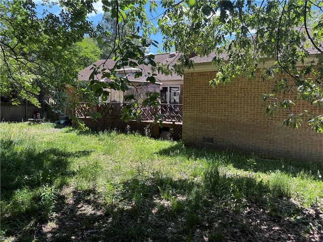 view of yard with a wooden deck