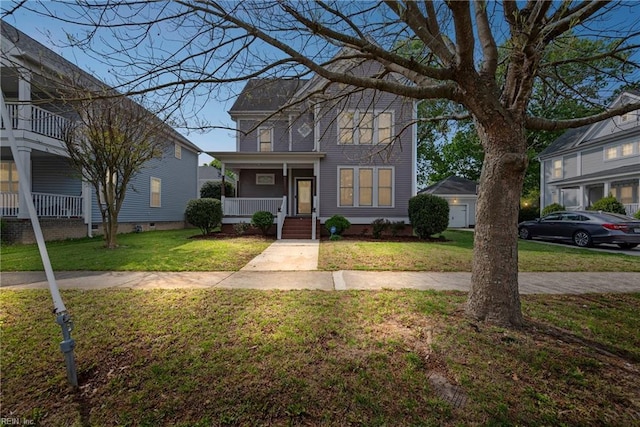 traditional-style house with a front yard and covered porch