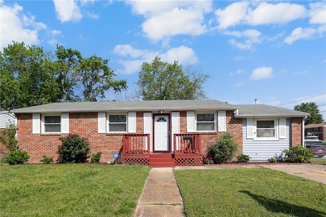 single story home featuring brick siding and a front lawn