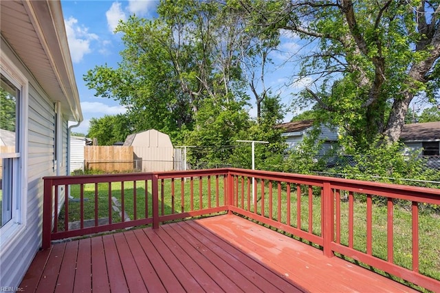 wooden terrace featuring fence