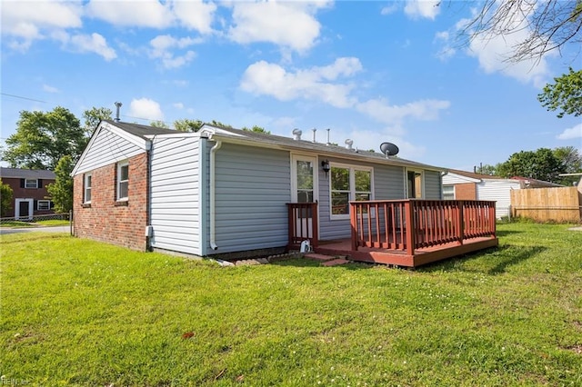 rear view of property with a wooden deck