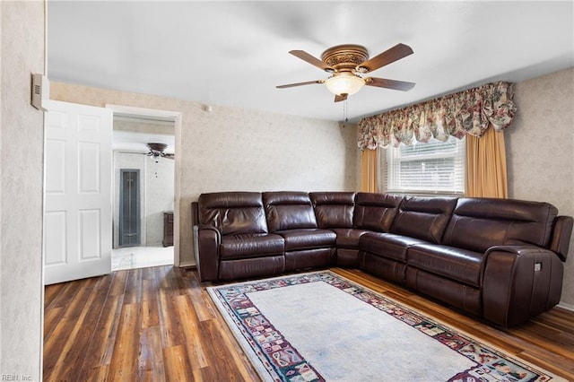 living room with a ceiling fan and wood finished floors